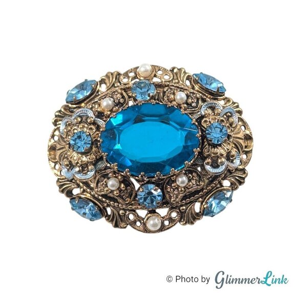 Vintage 1960s Germany Ornate Oval Blue Glass Domed Filigree Gold Tone Brooch Pin